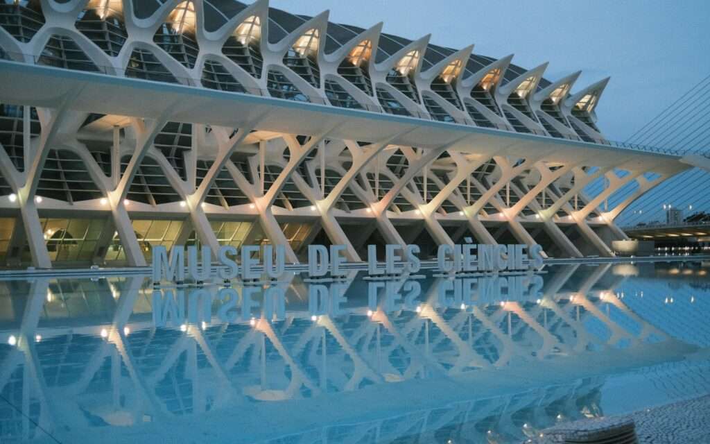 The Science Museum reflected in the pools of Valencia's City of Arts and Sciences at dusk